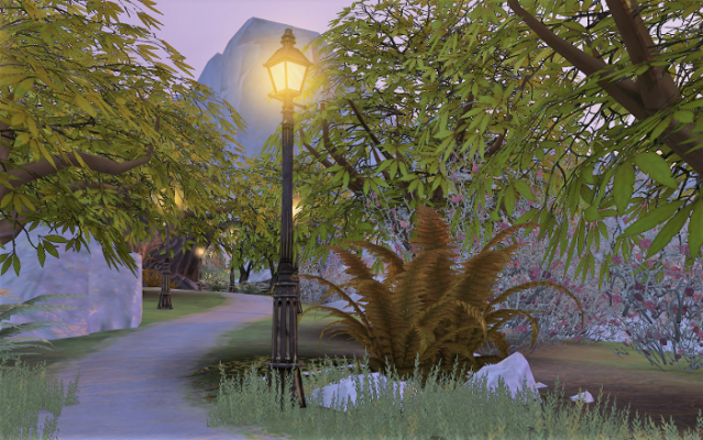 a path at sunset with a glowing street light